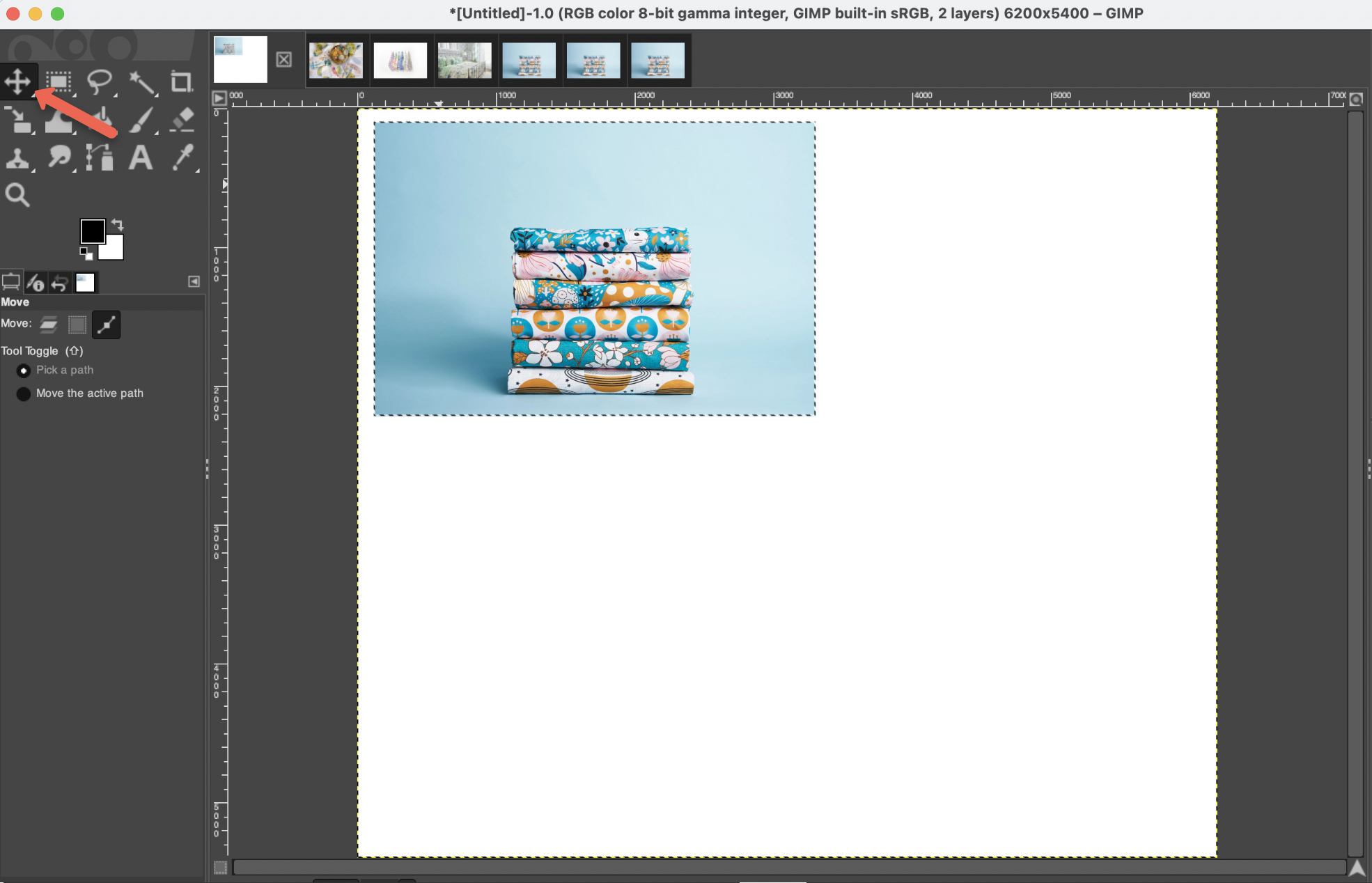 Screenshot of Gimp with red arrow pointing to the move tool