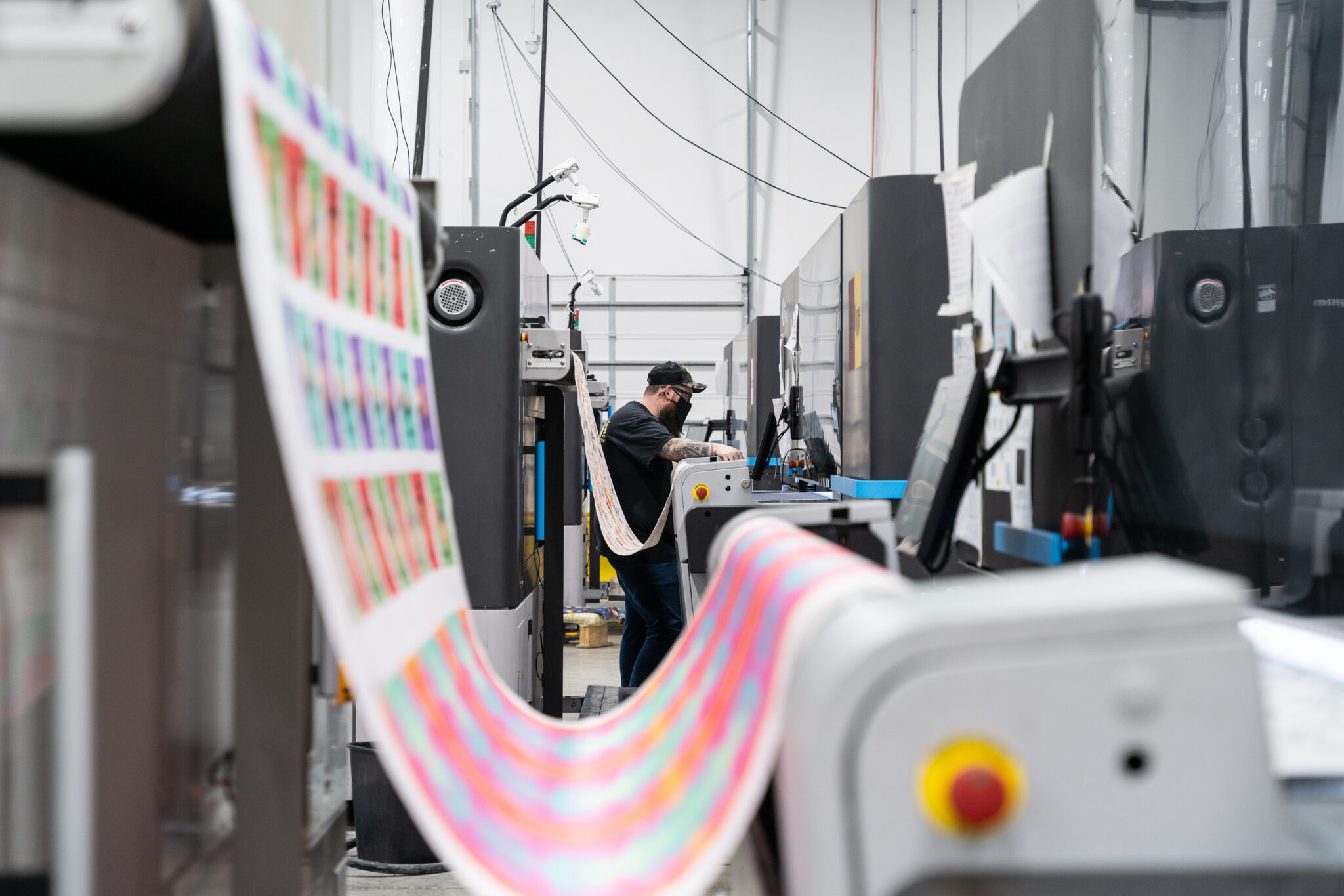 a spoonflower employee printing fabric on a wide format printer