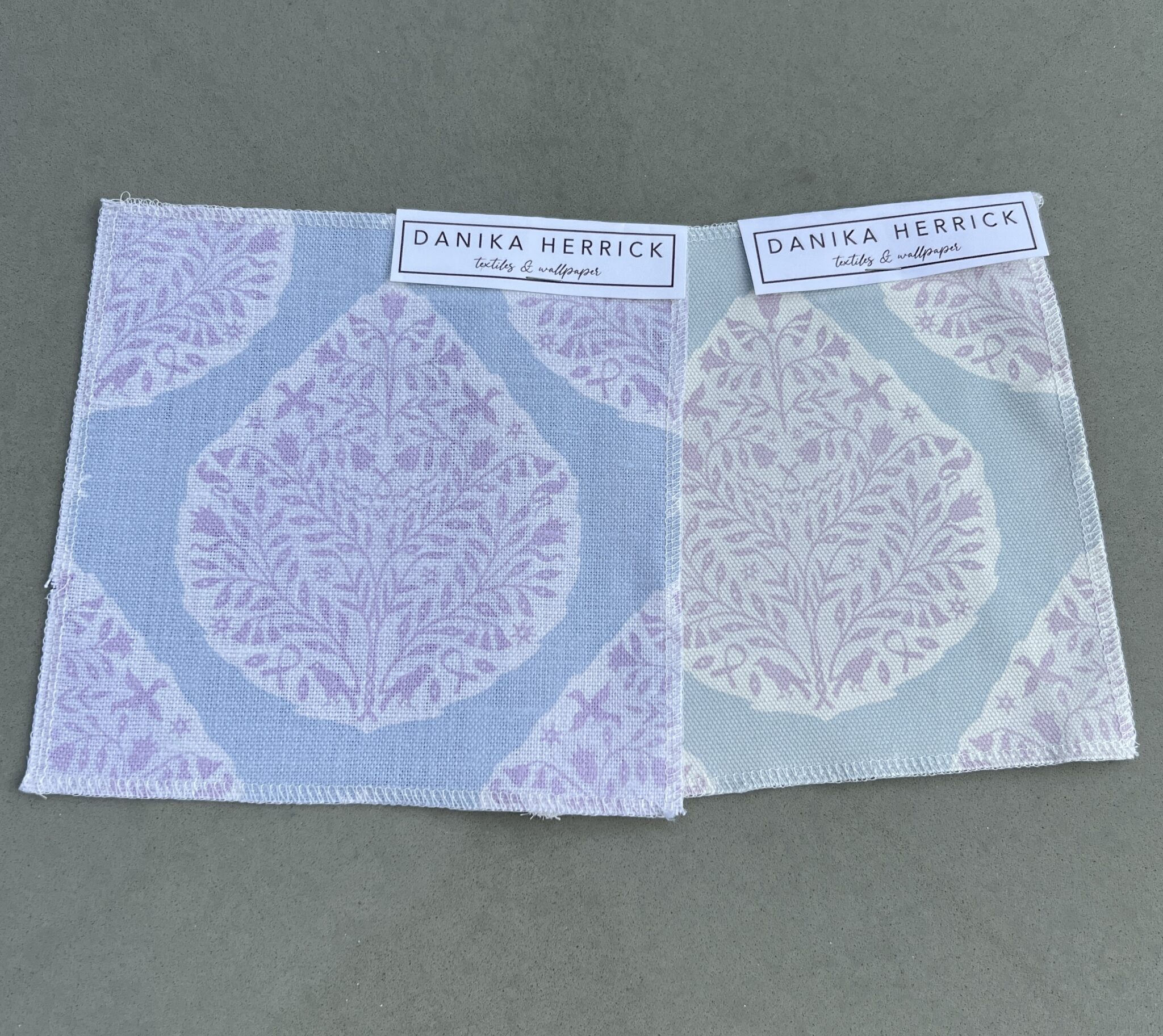 two swatches of paisley fabric with cool versus warm tones