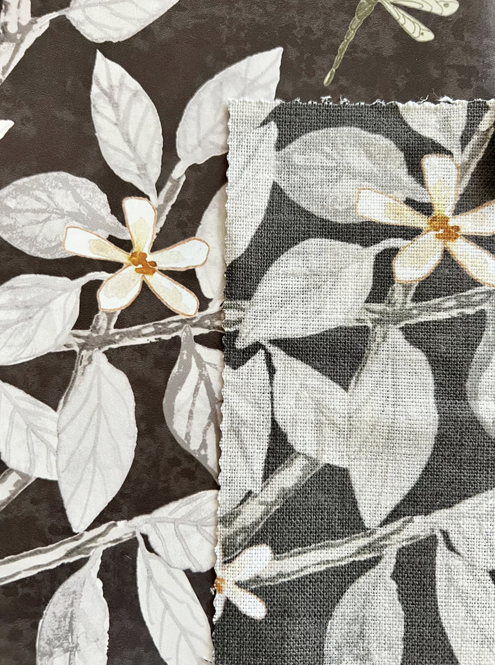 a floral design on a brown background printed on wallpaper and fabric