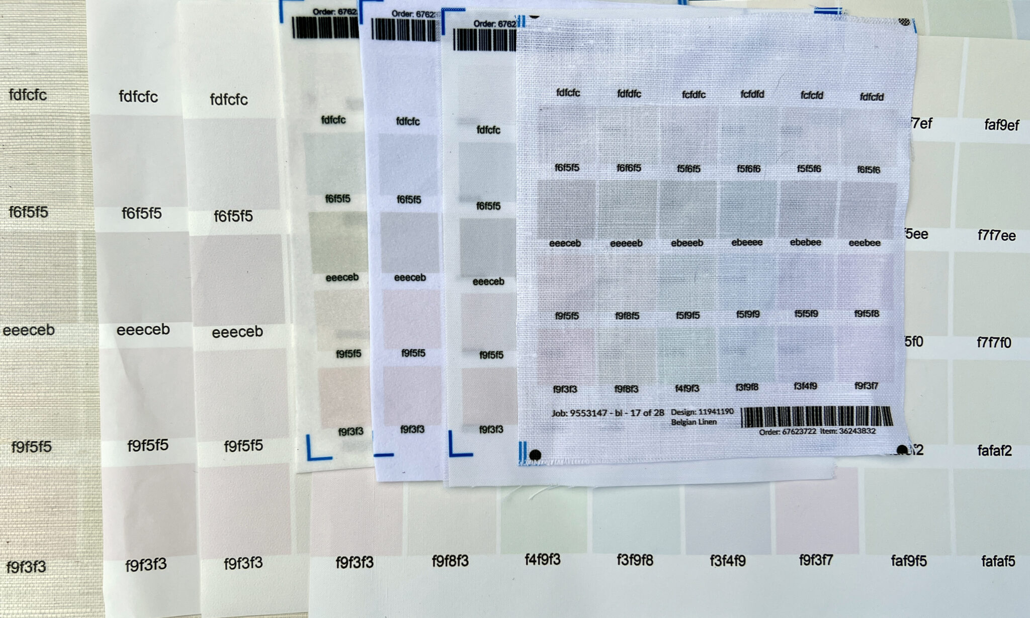 various white swatches on various fabric and paper substrates