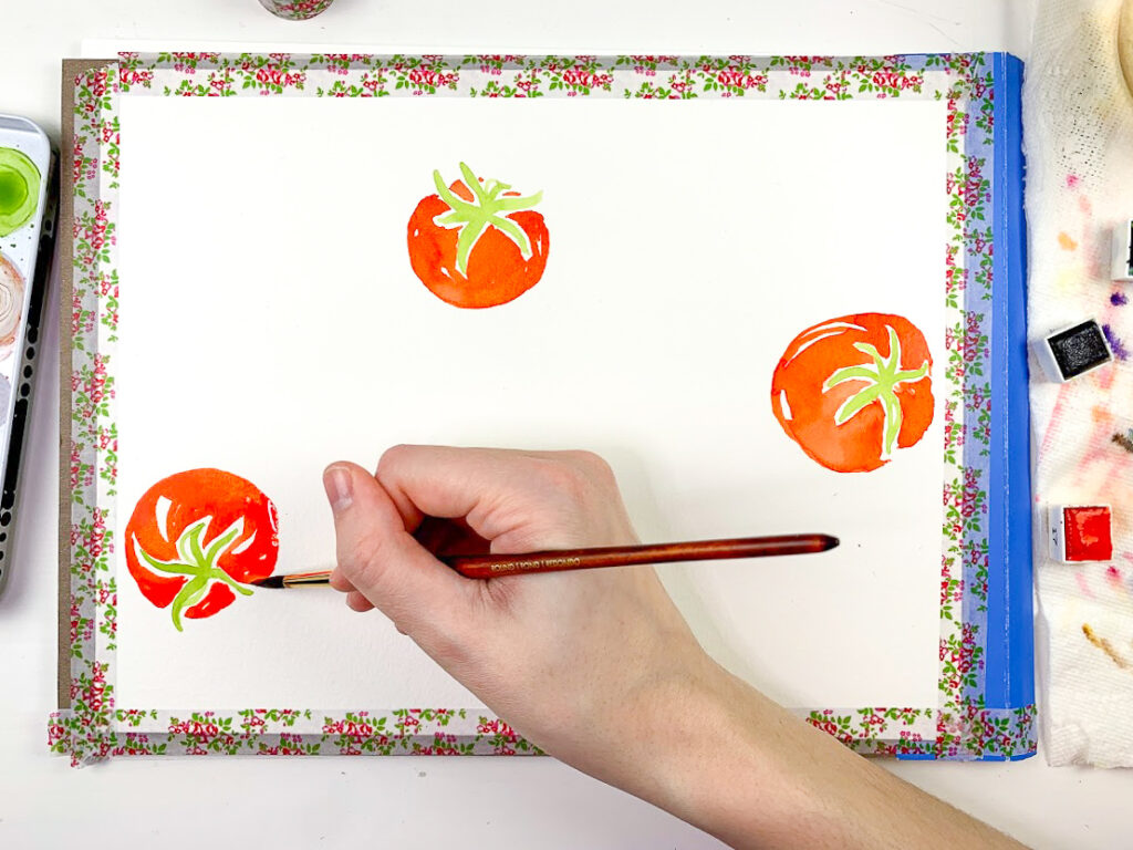 an artist painting watercolor tomatoes