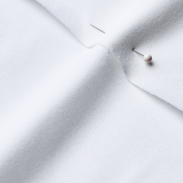 Close up of unprinted white cotton spandex jersey fabric