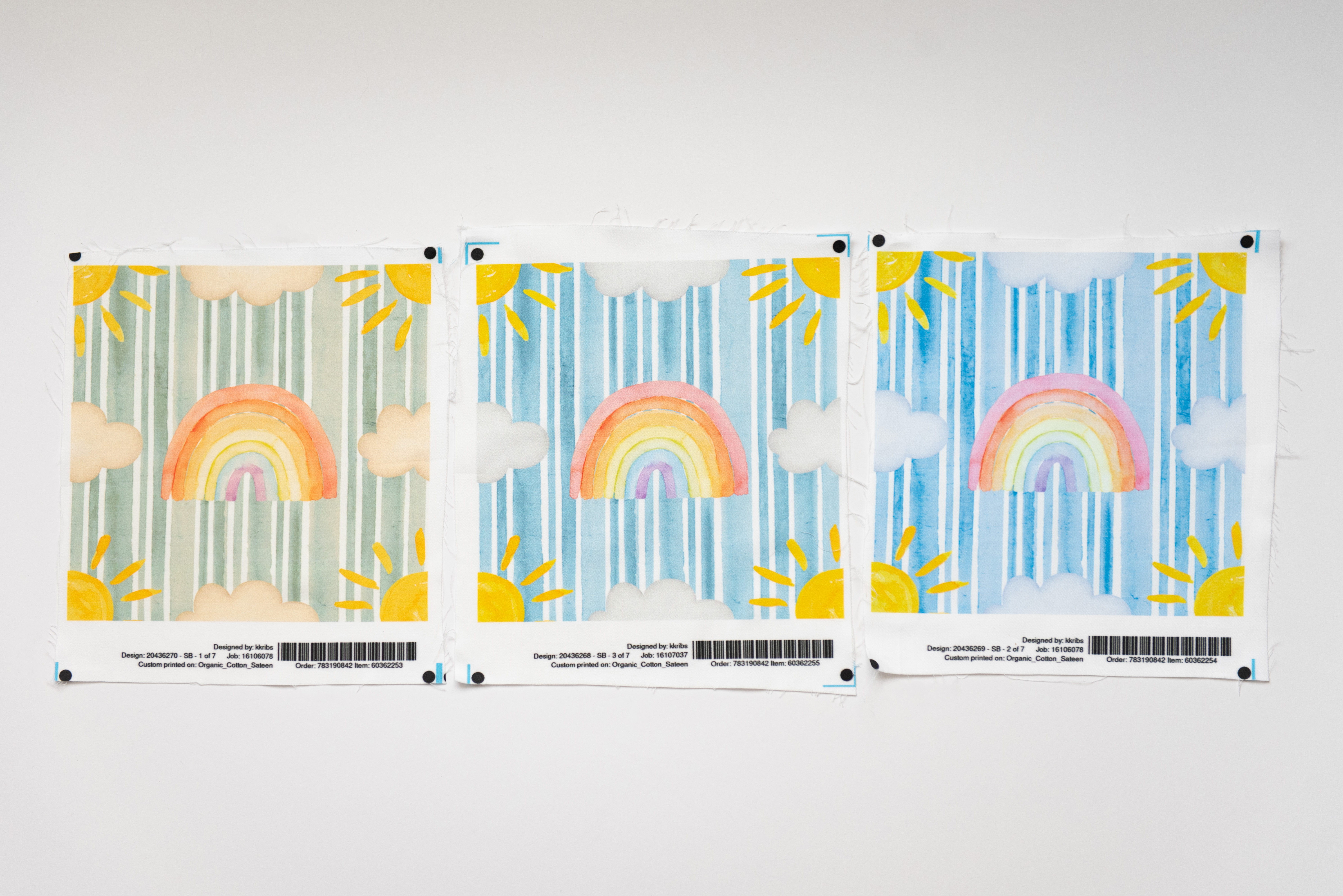 three swatches with blue stripes, rainbows/clouds/suns with varying levels of color warmth